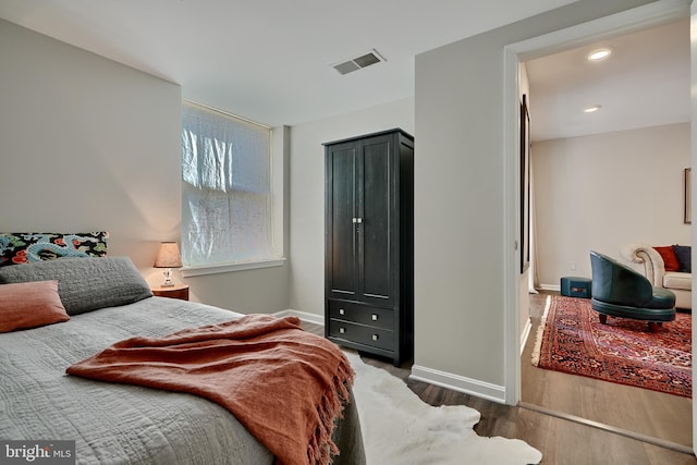 bedroom with wood-type flooring