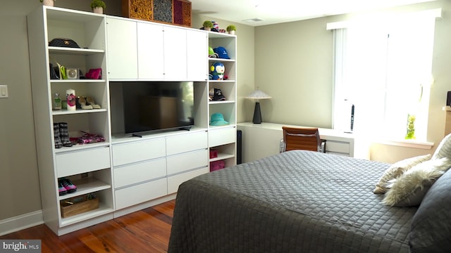 bedroom featuring dark wood-type flooring