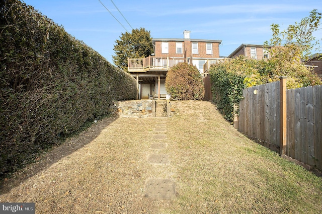 view of yard featuring a wooden deck