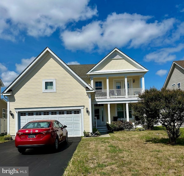 view of front of home featuring a front yard, covered porch, and a balcony