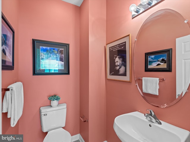 bathroom featuring sink and toilet