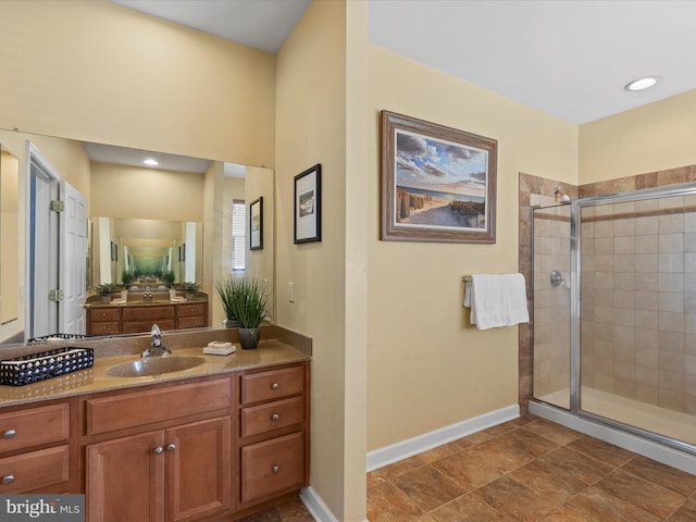 bathroom with vanity, tile patterned flooring, and a shower with shower door