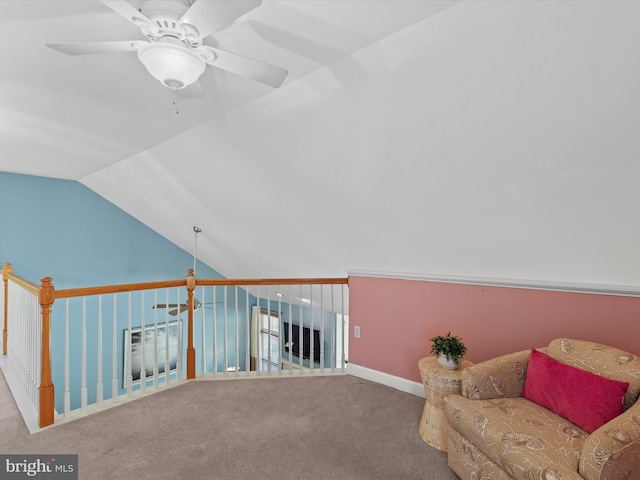 sitting room with lofted ceiling, ceiling fan, and carpet floors