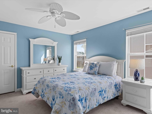 carpeted bedroom featuring ceiling fan