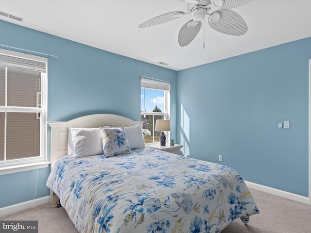 bedroom featuring ceiling fan and light colored carpet