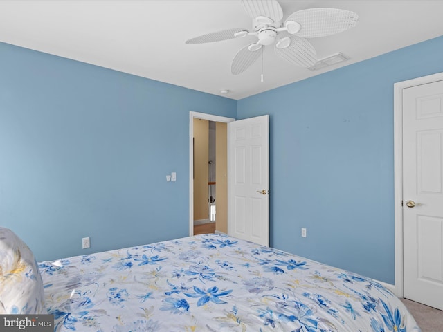 carpeted bedroom with ceiling fan