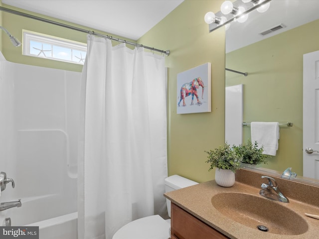 full bathroom featuring toilet, shower / tub combo, and vanity