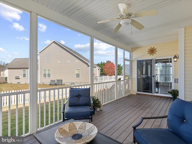 sunroom featuring a wealth of natural light and ceiling fan