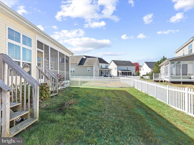 view of yard featuring a sunroom