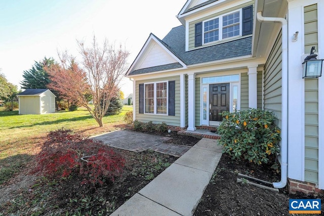 doorway to property featuring a yard