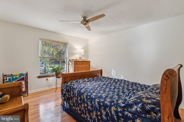 bedroom featuring hardwood / wood-style flooring and ceiling fan