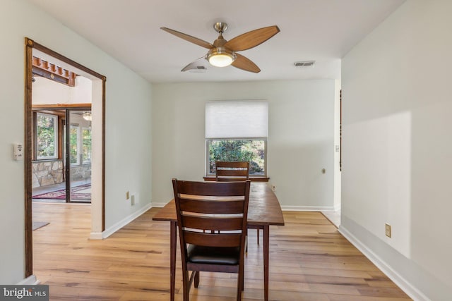 dining room featuring ceiling fan, plenty of natural light, and light hardwood / wood-style flooring