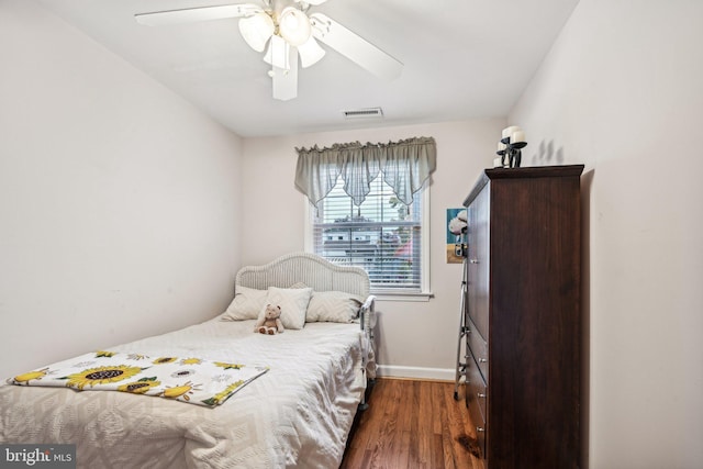 bedroom featuring dark hardwood / wood-style floors and ceiling fan