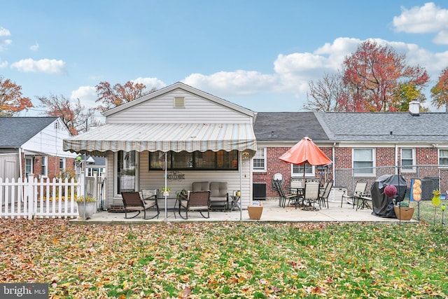 rear view of property with a patio area