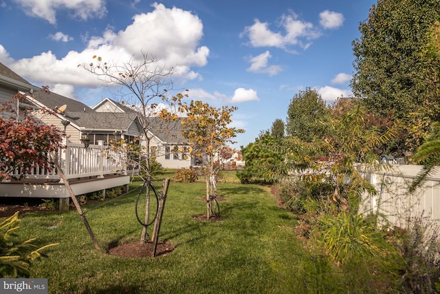 view of yard featuring a wooden deck