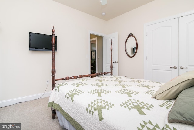 carpeted bedroom with a closet and ceiling fan