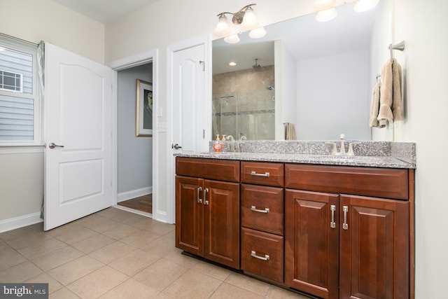 bathroom featuring vanity, walk in shower, and tile patterned floors