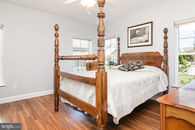 bedroom with ceiling fan and hardwood / wood-style floors