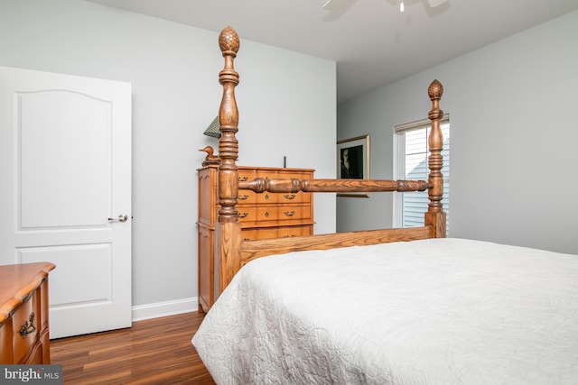 bedroom with dark wood-type flooring and ceiling fan