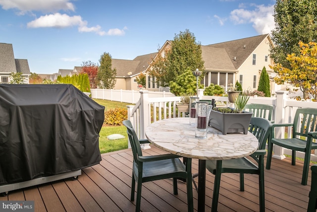 wooden deck featuring grilling area