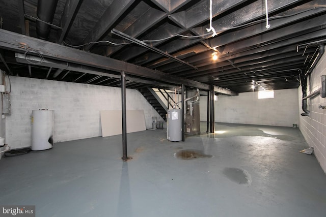 basement with water heater and heating unit