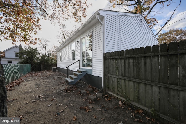 view of property exterior with cooling unit