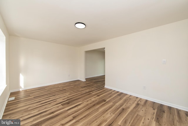 spare room with hardwood / wood-style flooring