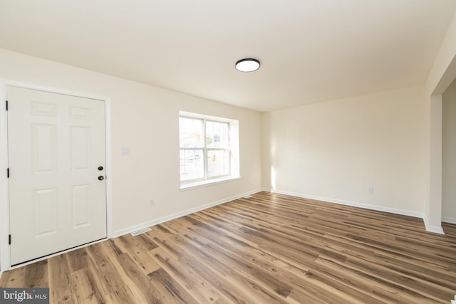 entrance foyer featuring wood-type flooring