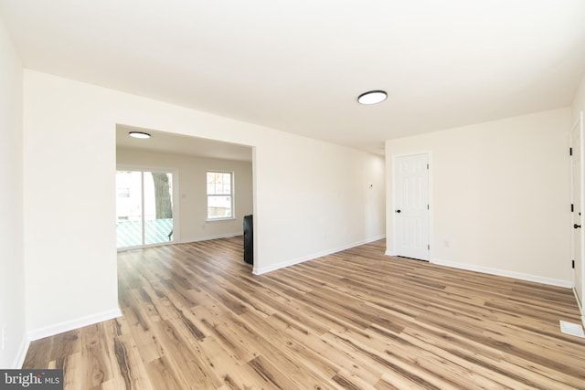 spare room featuring light hardwood / wood-style flooring