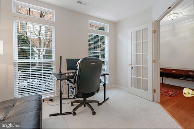 office with french doors and light wood-type flooring