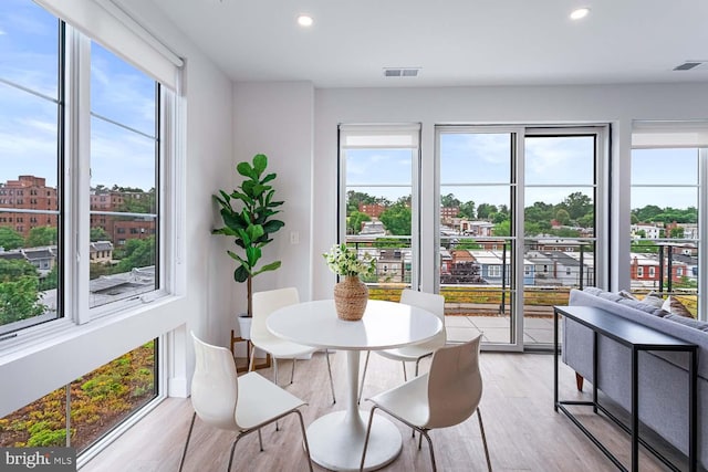 dining area featuring light wood-type flooring