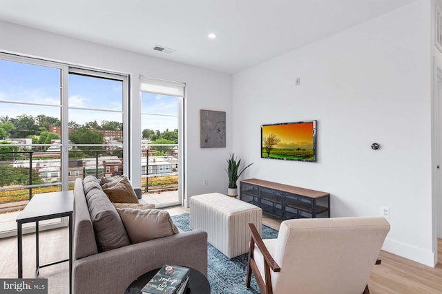 living room with light hardwood / wood-style floors