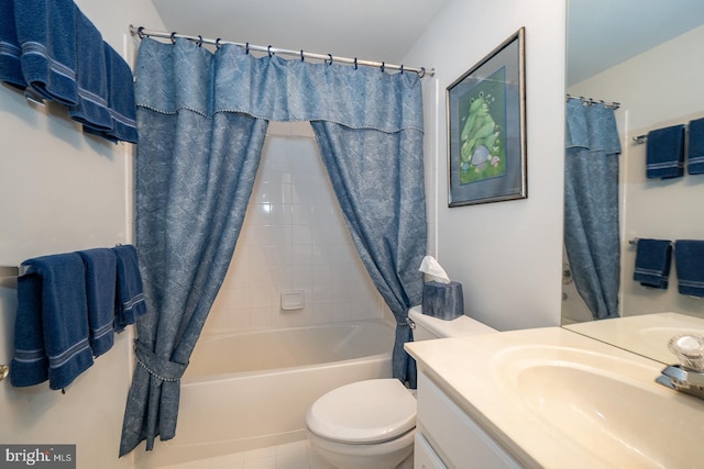 full bathroom featuring shower / tub combo, vanity, and toilet