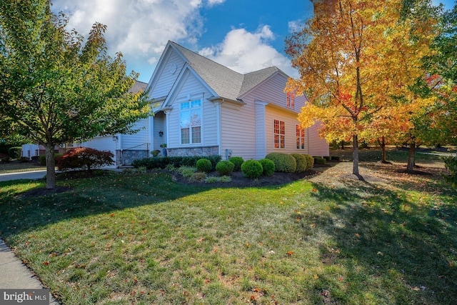 view of property exterior featuring a lawn