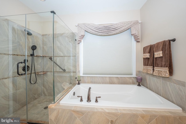 bathroom with separate shower and tub