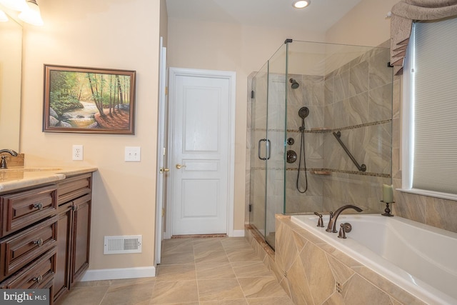 bathroom featuring separate shower and tub, tile patterned floors, and vanity