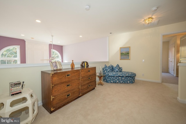 living area featuring light colored carpet