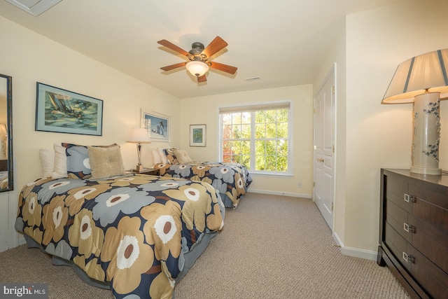 bedroom featuring ceiling fan and light colored carpet