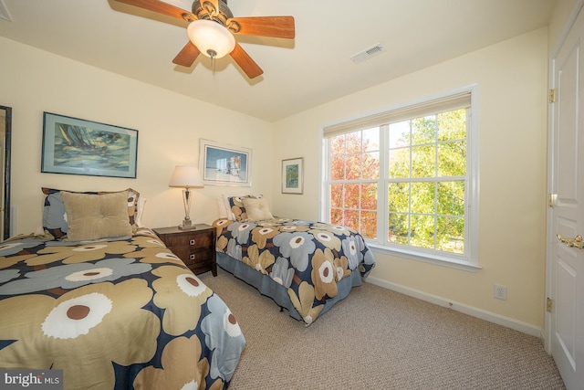 bedroom featuring ceiling fan and light colored carpet