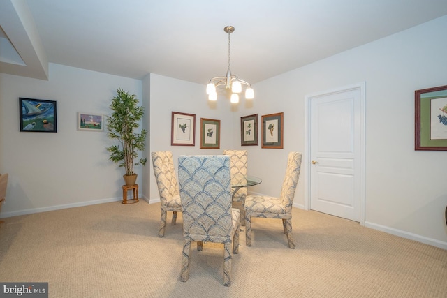 carpeted dining room featuring an inviting chandelier