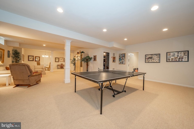 rec room featuring light carpet and decorative columns