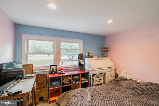 bedroom featuring multiple windows