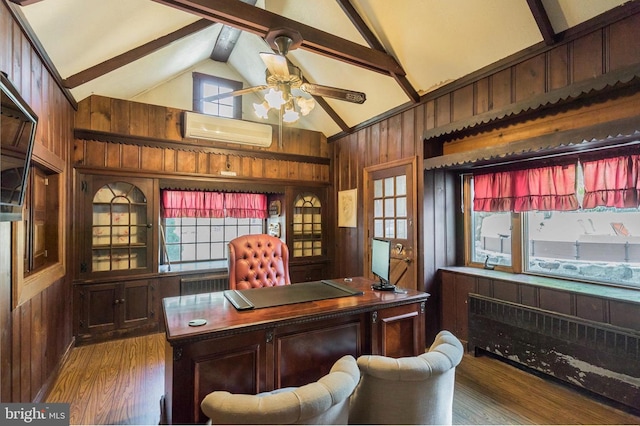 office area with wood walls, radiator heating unit, beam ceiling, a wall mounted AC, and dark hardwood / wood-style floors