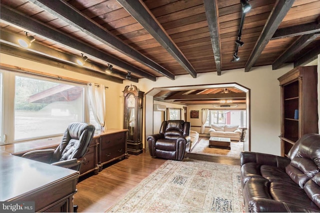 home office featuring light hardwood / wood-style flooring, beam ceiling, wooden ceiling, and rail lighting