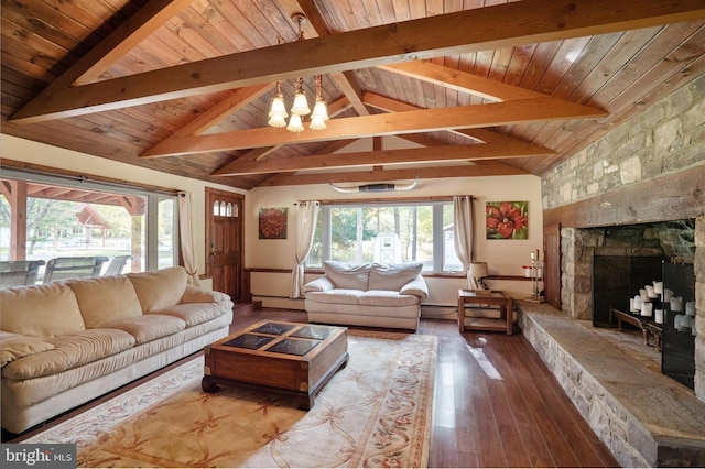 living room with beam ceiling, hardwood / wood-style floors, a notable chandelier, a fireplace, and high vaulted ceiling