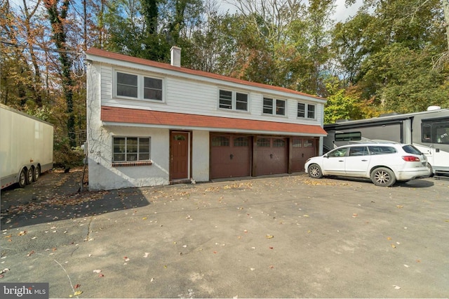29 Boulder Rd, Upper Black Eddy, PA 18972 - townhome / multi-family property with a chimney and an attached garage