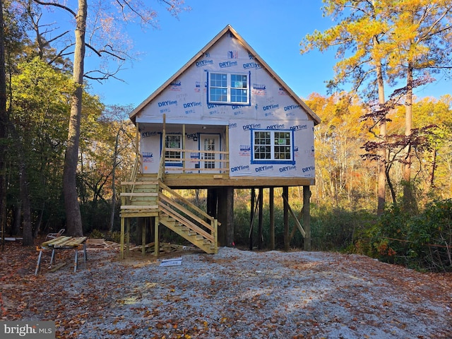 back of house featuring covered porch