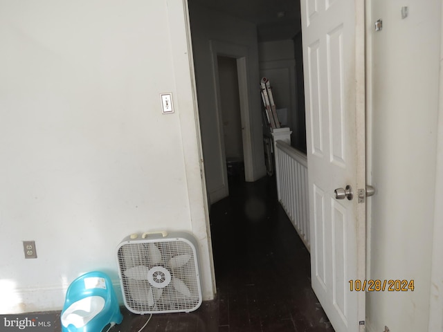 corridor featuring dark hardwood / wood-style floors