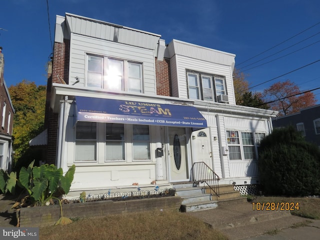 view of front of home featuring cooling unit