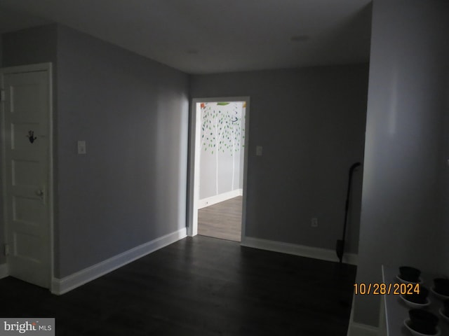 spare room with dark hardwood / wood-style flooring